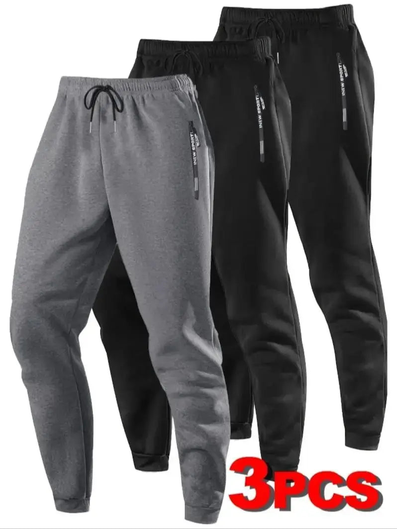 Zip Pockets Set of Three Solid Color Regular Fit Joggers Elastic Cuffs, Zip Pockets, Letter Prints, Drawstrings Suitable for Wor