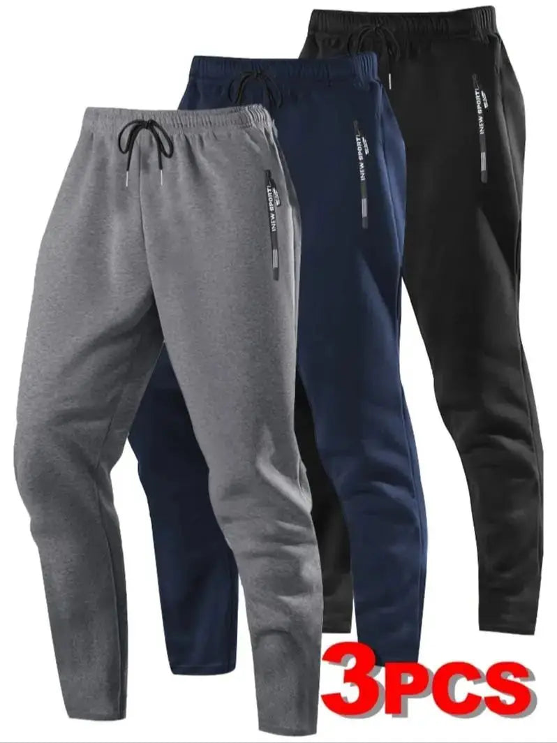 Zip Pockets Set of Three Solid Color Regular Fit Joggers Elastic Cuffs, Zip Pockets, Letter Prints, Drawstrings Suitable for Wor