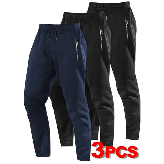 Zip Pockets Set of Three Solid Color Regular Fit Joggers Elastic Cuffs, Zip Pockets, Letter Prints, Drawstrings Suitable for Wor
