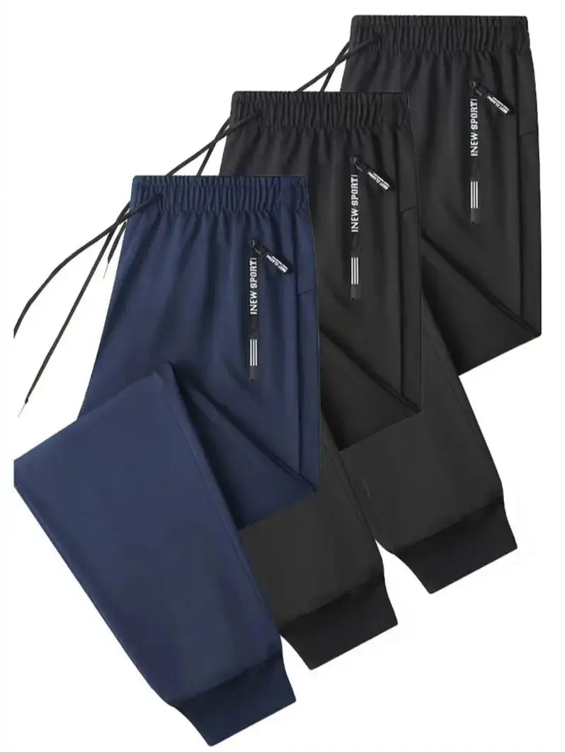 Zip Pockets Set of Three Solid Color Regular Fit Joggers Elastic Cuffs, Zip Pockets, Letter Prints, Drawstrings Suitable for Wor