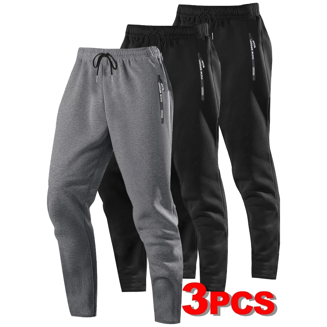Zip Pockets Set of Three Solid Color Regular Fit Joggers Elastic Cuffs, Zip Pockets, Letter Prints, Drawstrings Suitable for Wor
