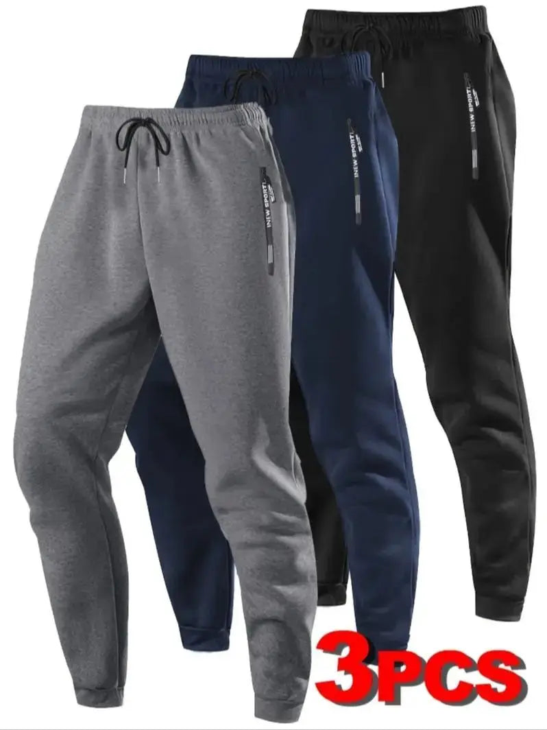 Zip Pockets Set of Three Solid Color Regular Fit Joggers Elastic Cuffs, Zip Pockets, Letter Prints, Drawstrings Suitable for Wor